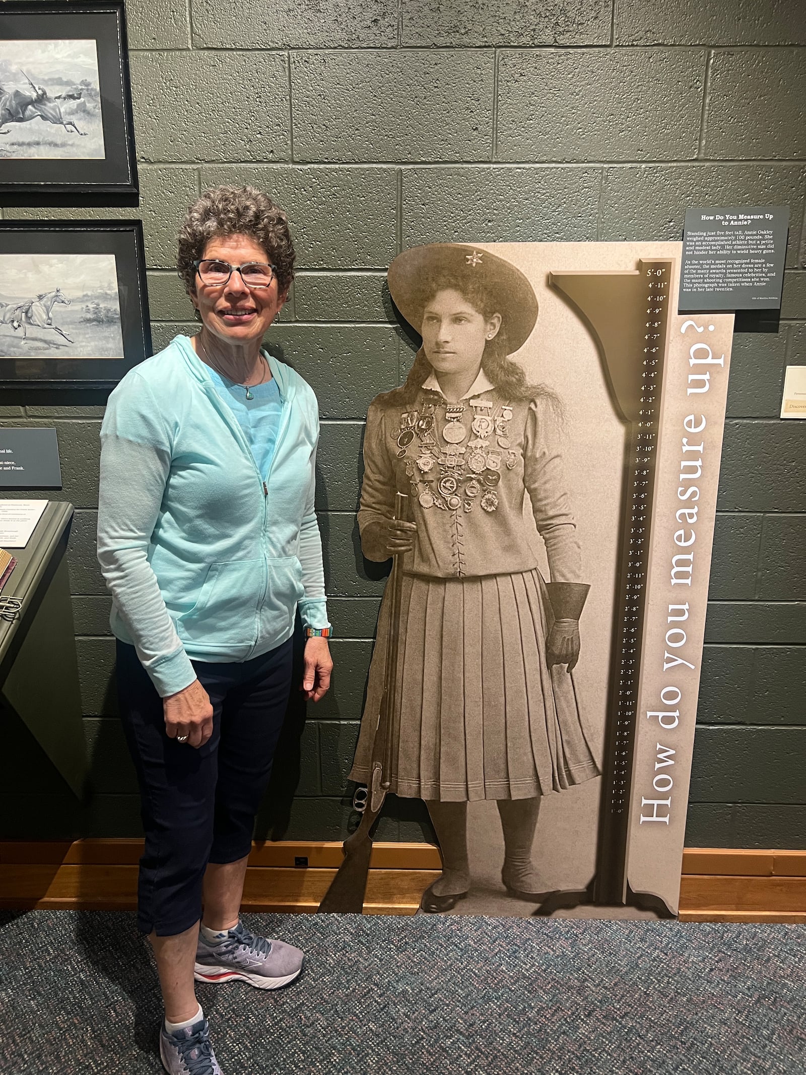 Eileen Litchfield stands next to the full-size Annie Oakley who was five feet tall.
Contributed