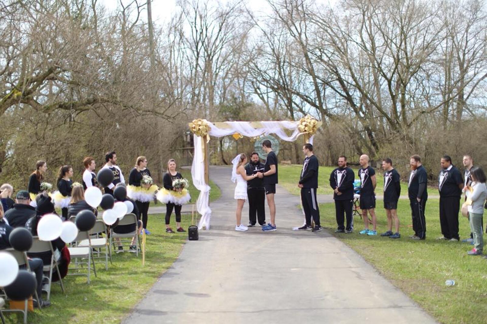 Alex and Kenzie Bruns, and some members of the wedding party, wore running attire to their wedding at Smith Park in Middletown. SUBMITTED PHOTO
