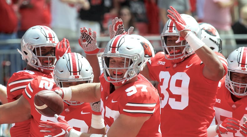 Ohio State’s Nick Bosa celebrates after recovering a fumble for a touchdown against Oregon State on Saturday, Sept. 1, 2018, at Ohio Stadium in Columbus. David Jablonski/Staff