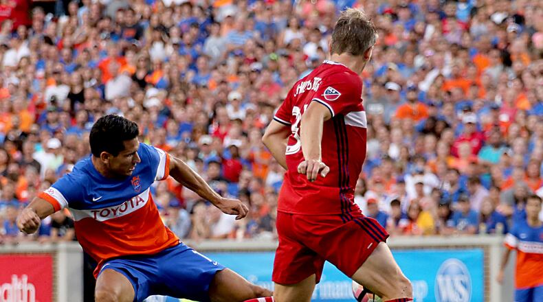 Contributed photo/WCPO FC Cincinnati forward Danni Konig keeps the ball away from Chicago Fire’s Bastian Schweinsteiger during their U.S. Open Cup match at Nippert Stadium in Cincinnati Wednesday, June 28, 2017.