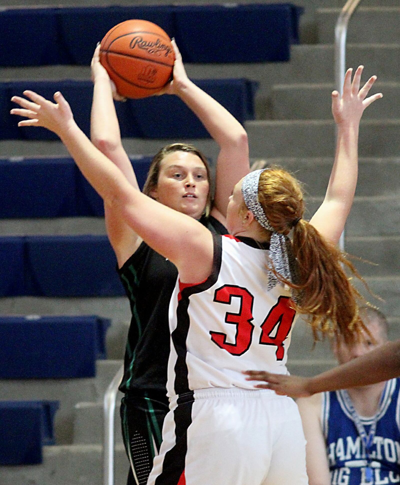 Madison’s Kelli Bush (34) applies defensive pressure to New Miami’s Alyssa Robinette on Saturday during the inaugural All-Butler County All-Star girls basketball game at the Hamilton Athletic Center. CONTRIBUTED PHOTO BY E.L. HUBBARD
