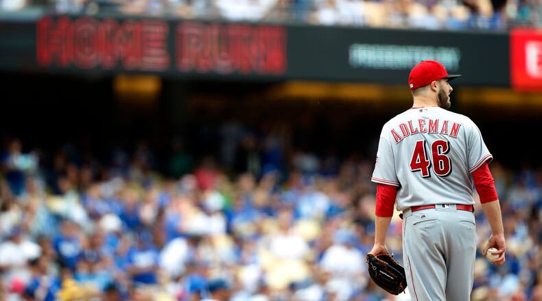 Cincinnati Reds starting pitcher Tim Adleman reacts after a solo home run by Los Angeles Dodgers’ Chase Utley during the fifth inning of a baseball game, Sunday, June 11, 2017, in Los Angeles. (AP Photo/Ryan Kang)