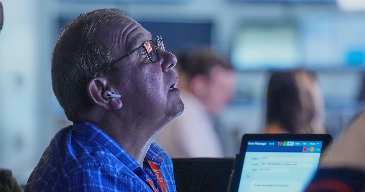 Wall Street holds steadier following mixed profit reports from Target, Lowe's and other...