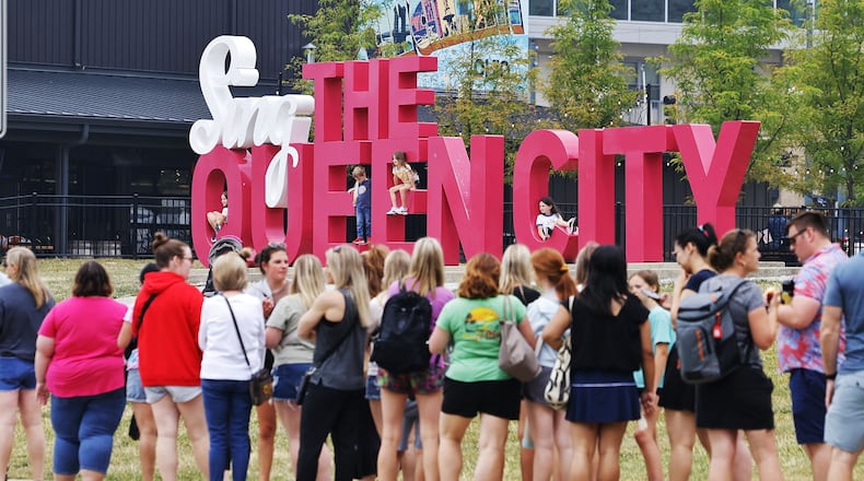 Fans of music sensation Taylor Swift are throughout the downtown Cincinnati area Thursday, June 29, 2023 ahead of "The Eras Tour" two-day stop at Paycor Stadium on Friday and Saturday. Swift's merchandise trailer rolled into town on Wednesday and fans lined up in the early morning hours, in a line that spanned blocks, to make a purchase. NICK GRAHAM/STAFF