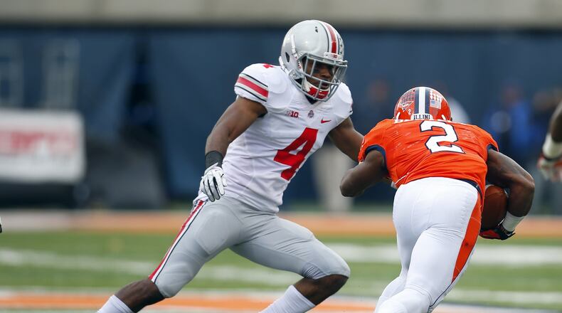 Ohio State safety C.J. Barnett (4) tackles Illinois quarterback Nathan Scheelhaase (2) during the first half of an NCAA college football game on Saturday, Nov. 16, 2013, in Champaign, Ill. Barnett, a Northmont product, is one of 18 players who will be honored Saturday on Senior Day. (AP Photo/Jeff Haynes)