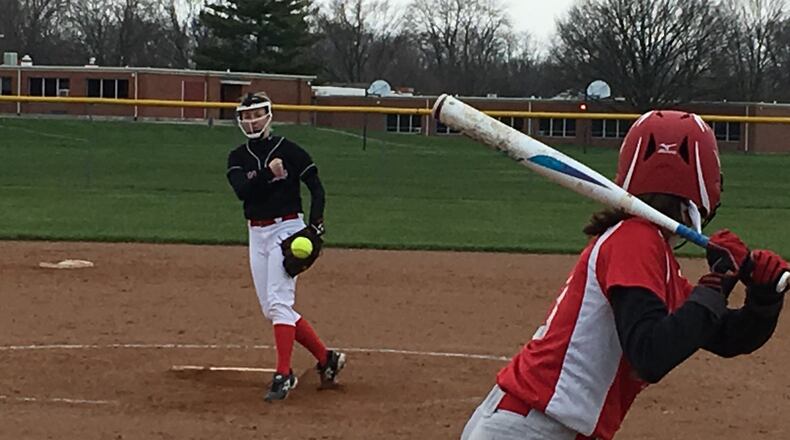 Madison’s Sabrina Dolph delivers a pitch to Abby Goodpaster of Carlisle during Friday’s game at Carlisle. RICK CASSANO/STAFF