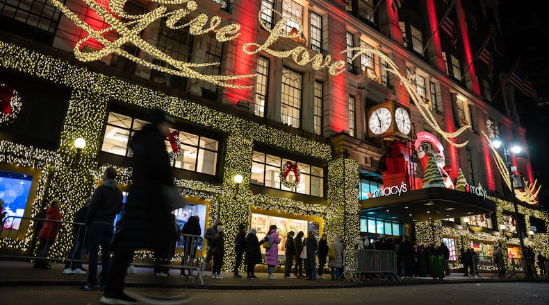 FILE - Shoppers wait in line to enter Macy's flagship store on Nov. 28, 2025 in New York. (AP Photo/Angelina Katsanis, File)