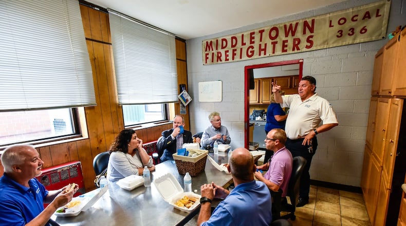 Middletown Fire Chief Paul Lolli, right, talks to city council members and city officials inside station 81 on North Clinton Street in Middletown Tuesday, June 18. They took a bus tour of the four fire stations in operation in Middletown and one of Fairfield Township’s more modern stations. NICK GRAHAM/STAFF