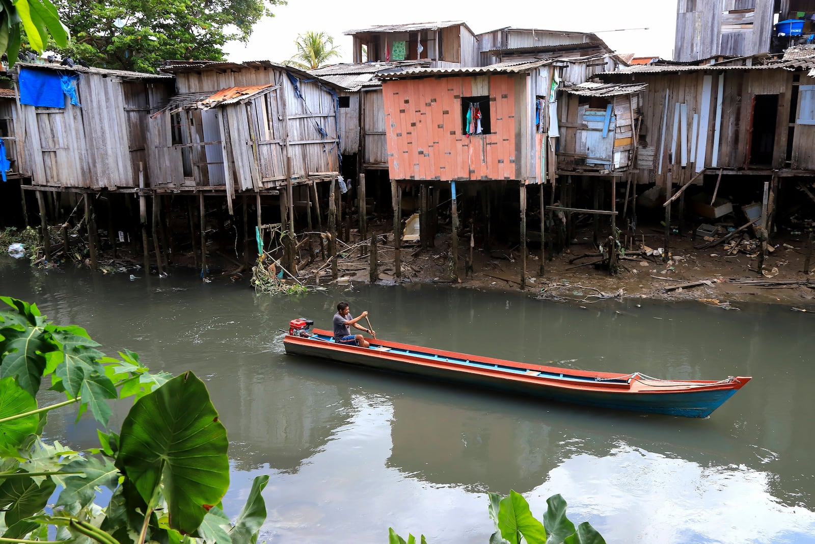 FILE - A boat goes down a tributary of the Tucunduba River in Belem, Brazil, Sept. 23, 2024. (AP Photo/Paulo Santos, File)