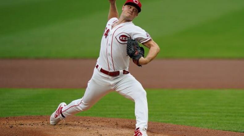 Cincinnati Reds starting pitcher Sonny Gray pitches in the first inning of the team's baseball game against the St. Louis Cardinals in Cincinnati, Tuesday, Sept. 1, 2020. (AP Photo/Bryan Woolston)
