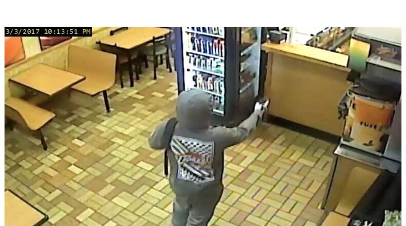 Middletown police have released photos of the person who jumped a counter at Subway on March 3, pointed a gun at employees but who didn’t steal any money.