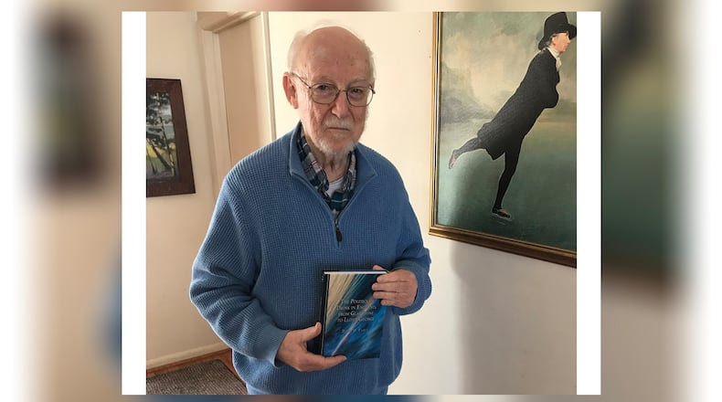 David Fahey holds a copy of one of his new books. MARY FULLER/CONTRIBUTED