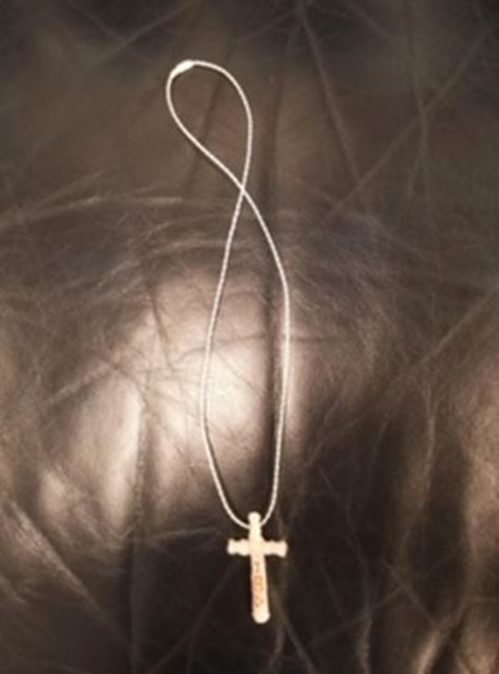 A cross necklace made by a Butler County Jail inmate that was confiscated a contraband BUTLER COUNTY SHERIFF'S OFFICE