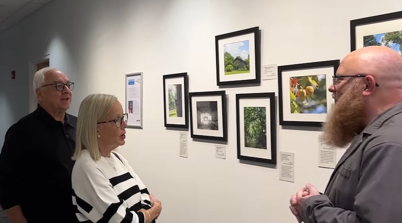 John and Susan Vaughn, left, visit the Fitton Center for Create Arts in Hamilton during the opening of the FotoFocus exhibits for 2024. CONTRIBUTED/TVHAMILTON