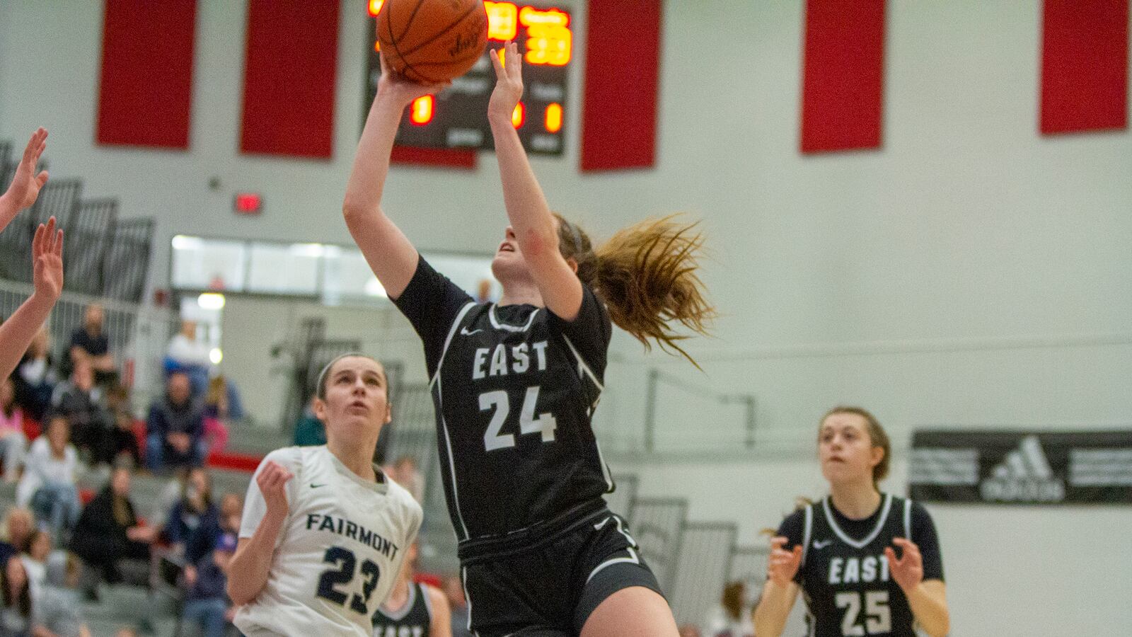Lakota East's Madison French shoots for two of her 29 points over Fairmont's Kenzie Roark during Saturday's Division I district final at Princeton High School. CONTRIBUTED/Jeff Gilbert