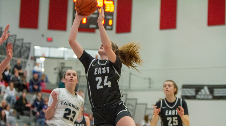 Lakota East's Madison French shoots for two of her 29 points over Fairmont's Kenzie Roark during Saturday's Division I district final at Princeton High School. CONTRIBUTED/Jeff Gilbert