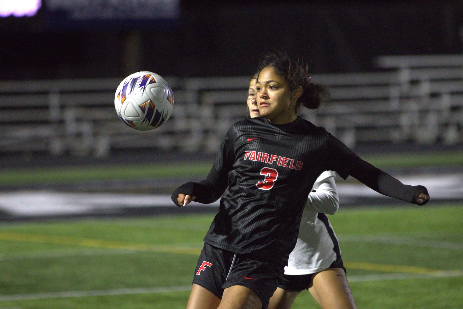 Fairfield's Kendyl Byndum gets into eyes the ball during her Division I district final game against Centerville on Thursday night at Lakota East. CHRIS VOGT / CONTRIBUTED