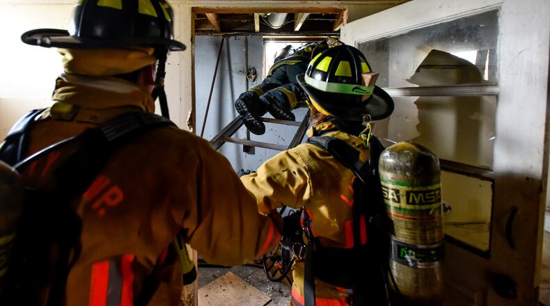 Ohio Gov. John Kasich signed Senate Bill 27, now known as the “Michael Louis Palumbo Jr. Act,” into law Jan. 4. It allows firefighters who have cancer to file claims with the Ohio Bureau of Workers Compensation. Pictured are firefighters from various Butler County jurisdictions during a training exercise last spring. STAFF FILE/2016