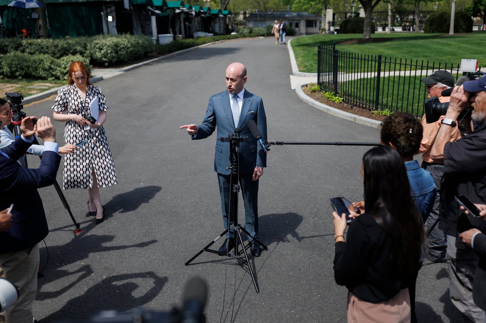 White House deputy chief of policy Stephen Miller speaks with reporters at the White House, Friday, April 18, 2025, in Washington. (AP Photo/Tom Brenner)