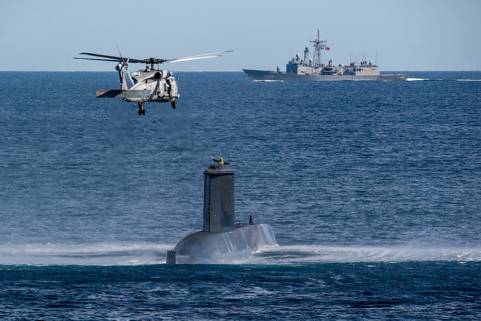 FILE - A Turkish navy helicopter, ship and submarine take part in a warfare exercise off the coast of Catania, Sicily, southern Italy, Monday, Feb. 26, 2024. (AP Photo/Salvatore Cavalli, File)