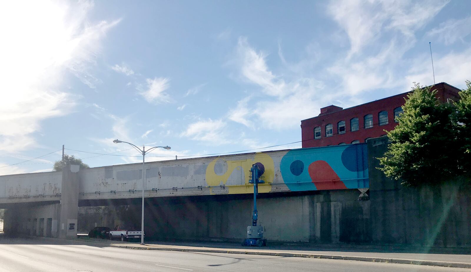 Local artists Jes McMillan is leading a group painting a train overpass near the intersection of  Keowee and First streets for the East Dayton Arts District.  Vincent Detrick, Ileana Del Campo-Gray,  Kate Edmondson and Amy Dallis are also helping with the project.
