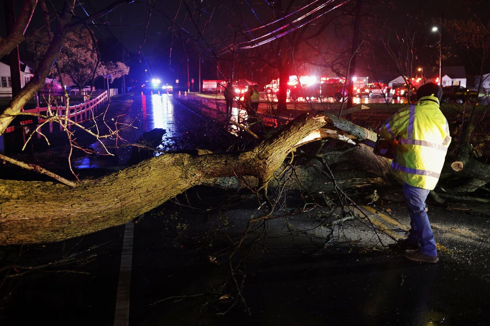 Crews from St. Clair Township, Butler County Sheriff's Office, Butler County Engineers Office, Butler County Emergency Management Agency and others were out assessing damage and cleaning up debris after strong winds ripped through the area of Trenton Road in St. Clair Township Sunday, March 30, 2015. NICK GRAHAM/STAFF