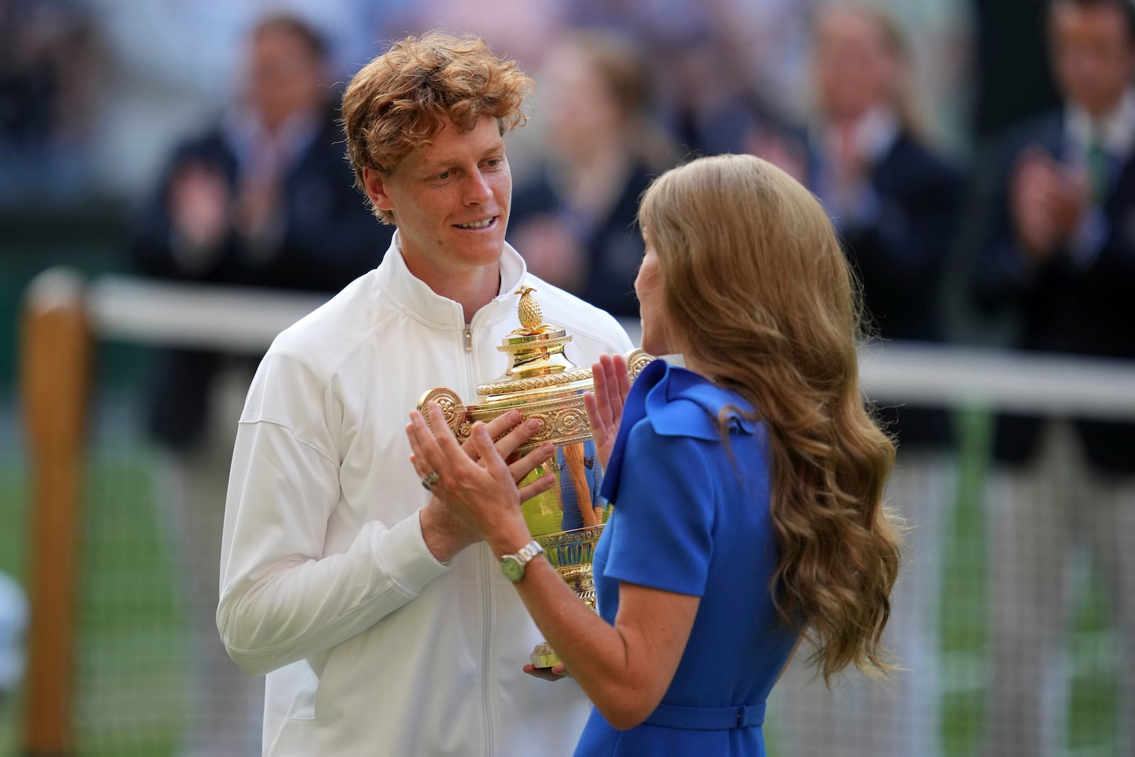 Italy's Jannik Sinner receives the trophy from Kate, Princess of Wales, after beating Carlos Alcaraz of Spain to win the men's singles final at the Wimbledon Tennis Championships in London, Sunday, July 13, 2025. (AP Photo/Kin Cheung)