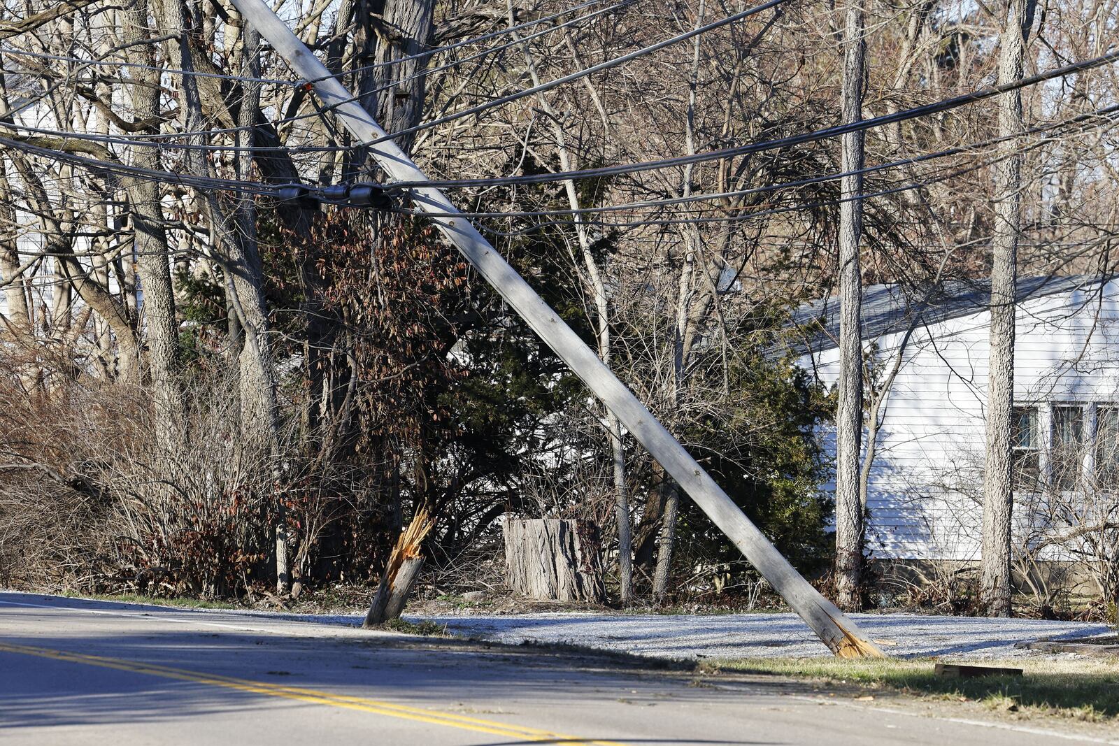 A utility pole was knocked over Monday when a driver lost control of his vehicle on Ohio 177. NICK GRAHAM/STAFF