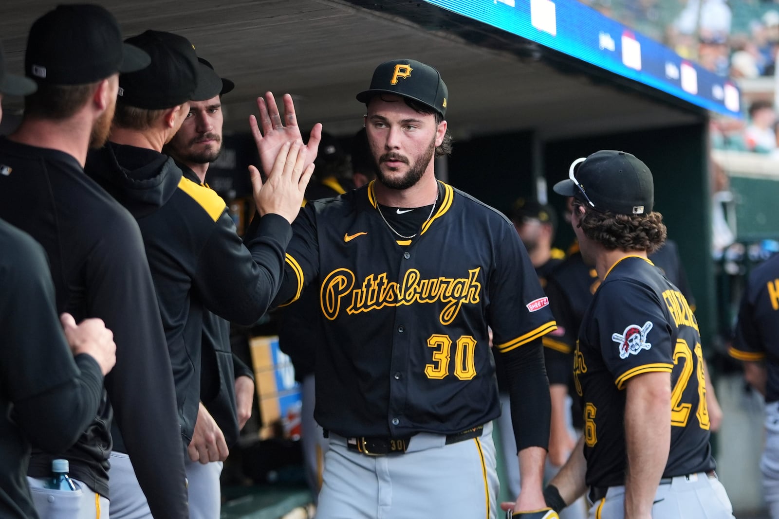 Pittsburgh Pirates pitcher Paul Skenes (30) high fives teammates after the sixth inning against the Detroit Tigers during the second baseball game of a doubleheader, Thursday, June 19, 2025, in Detroit. (AP Photo/Paul Sancya)