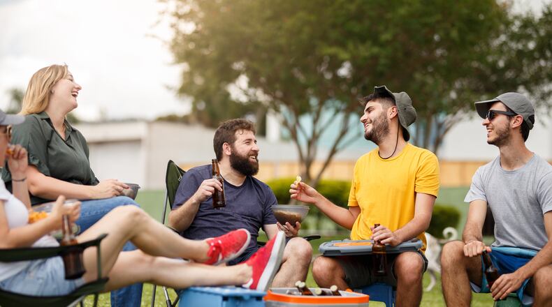 Tailgating at sporting events requires some planning. The main thing is food, but there are other items to consider having on-hand such as foot rests, battery-operated fans, team blankets, First Aid kits and more. ISTOCK PHOTO
