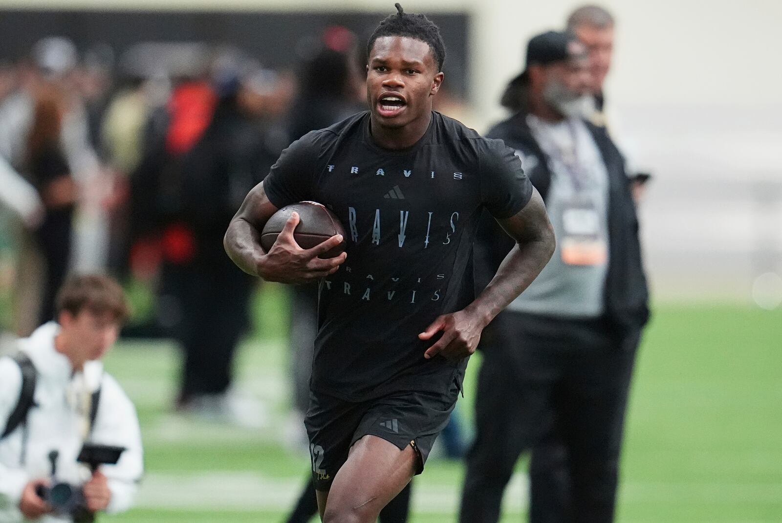 Colorado wide receiver Travis Hunter takes part in passing drills during Colorado's NFL football pro day Friday, April 4, 2025, in Boulder, Colo. (AP Photo/David Zalubowski)
