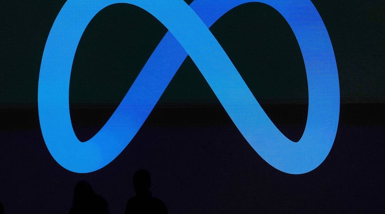 FILE -A Meta logo is shown on a video screen at LlamaCon 2025, an AI developer conference, in Menlo Park, Calif., April 29, 2025. (AP Photo/Jeff Chiu, File)