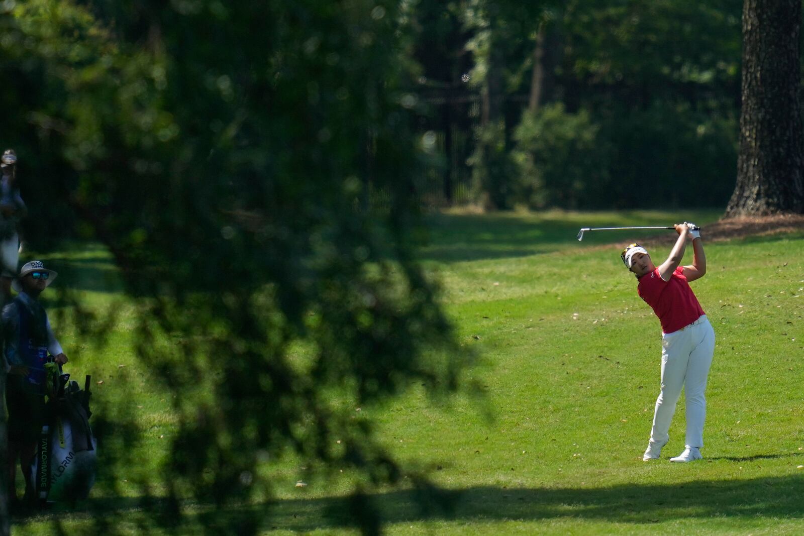 Haeran Ryu, of South Korea, hits from the second fairway during the third round of the Chevron Championship LPGA golf tournament Saturday, April 26, 2025, in The Woodlands, Texas. (AP Photo/Ashley Landis)