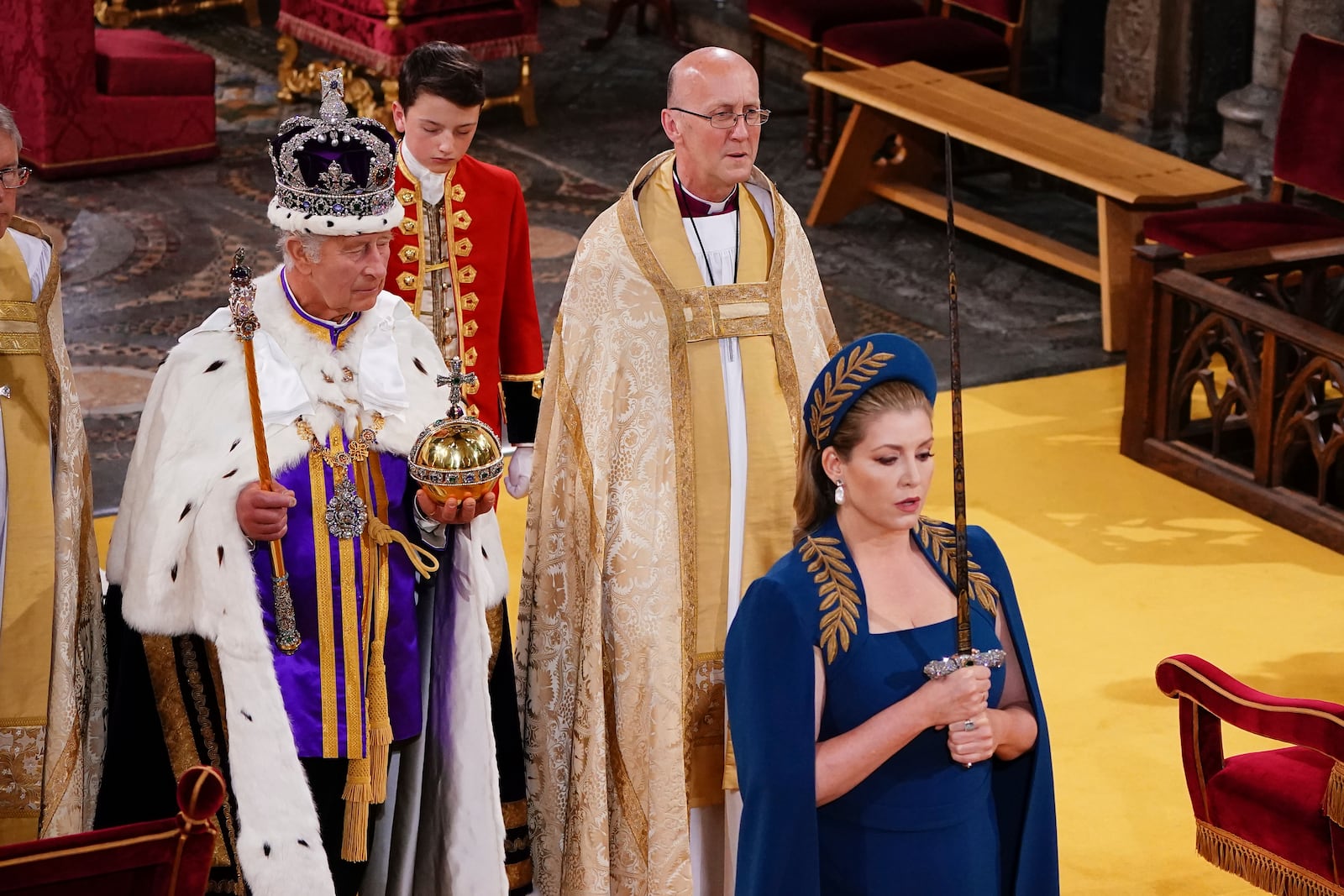 FILE - Lord President of the Council, Penny Mordaunt, holds the Sword of State walking ahead of King Charles III during his coronation ceremony in Westminster Abbey, London, Saturday May 6, 2023. (Yui Mok, Pool via AP, file)