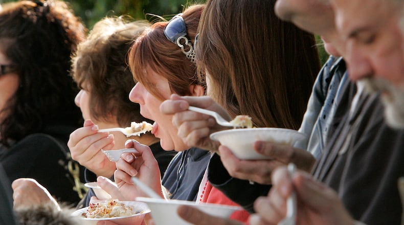 People lined Main Street in Waynesville Saturday eating food made with Sauerkraut as a part of the 2009 Ohio Sauerkraut Festival. Jim Noelker/Dayton Daily News