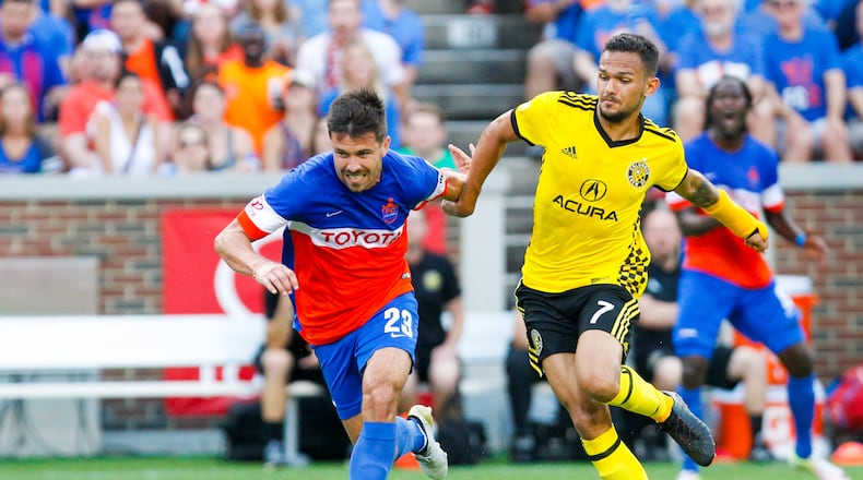 FC Cincinnati Andrew Weideman (23) battles Columbus Crew Artur midfielder (7) during their Open Cup match, held at Nippert Stadium on the campus of the University of Cincinnati, Wednesday, June 14, 2017. GREG LYNCH / STAFF