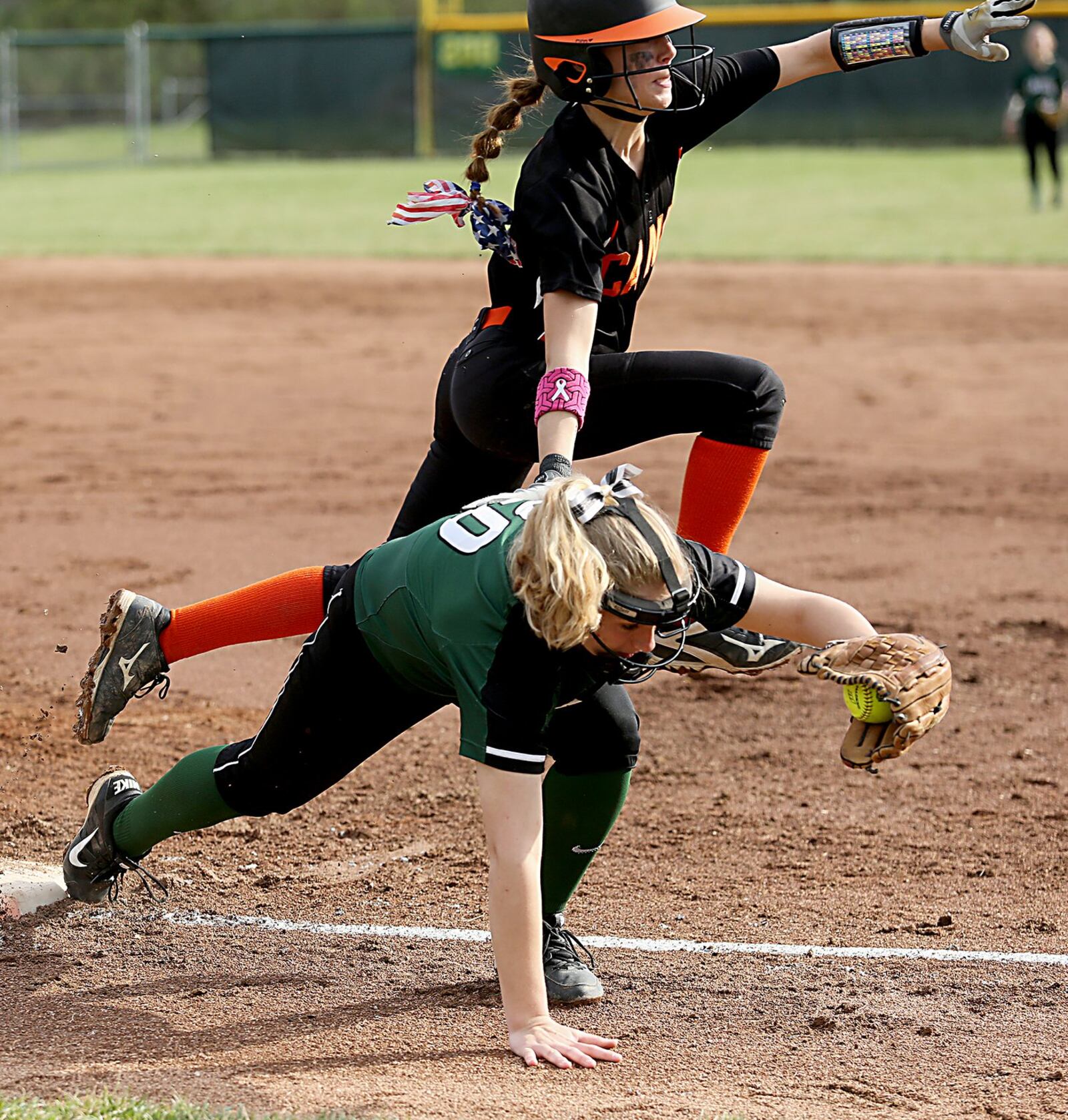 Badin first baseman Samantha Sander hangs on to the ball to get the out on Wilmington’s Kendra McKenna during their game at Mueller Stadium in Hamilton on Monday. CONTRIBUTED PHOTO BY E.L. HUBBARD