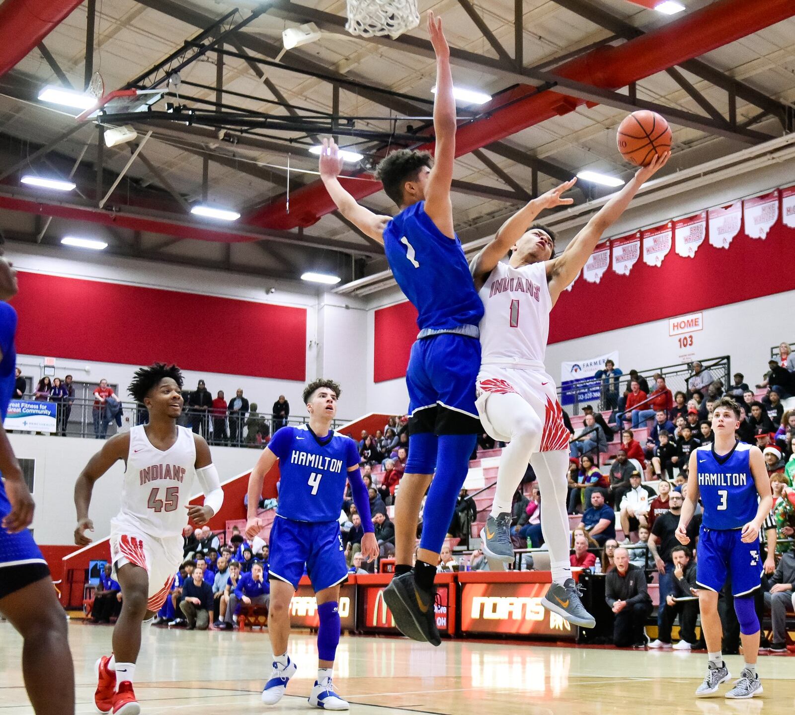 Fairfield’s Zavian Ricks goes up for a shot defended by Hamilton’s Trey Robinson during their game Dec. 21, 2018, at Fairfield. Hamilton won 57-42. NICK GRAHAM/STAFF