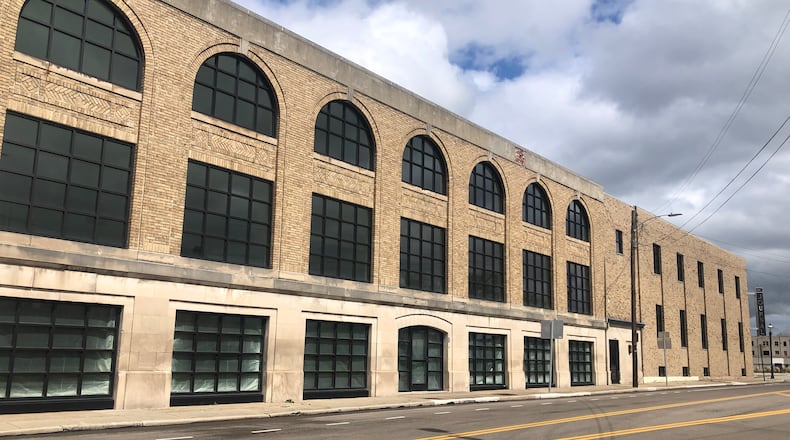 Small businesses that are considering opening in the former Middletown Journal building downtown may be eligible to apply for the city's new American Rescue Plan Act (ARPA) Infusion Grant Program. Raymond Scott, who purchased the former Journal building in 2020, said he spent $240,000 replacing 70 windows. RICK McCRABB/STAFF