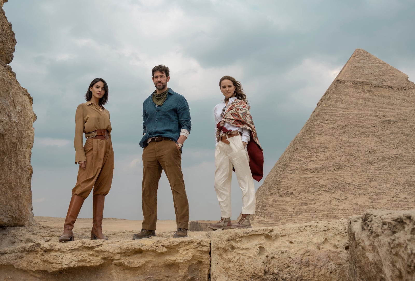 This image released by Apple TV+ shows Eiza Gonzalez, from left, John Krasinski, and Natalie Portman in a scene from the film "Fountain of Youth." (Dan Smith/Apple TV+ via AP)