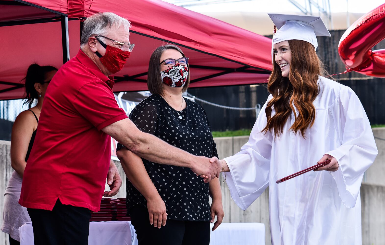 Madison High School drive-thru graduation ceremony at Land of Illusion