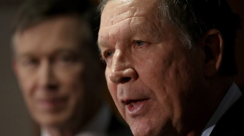 WASHINGTON, DC - FEBRUARY 23: Gov. John Kasich (R) (R-OH) speaks as Gov. John Hickenlooper (L) (D-CO) listens during a press conference February 23, 2018 in Washington, DC. The three governors unveiled a blueprint for improved health care in the U.S. during the press conference. (Photo by Win McNamee/Getty Images)