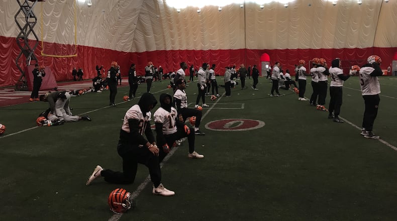 Cincinnati Bengals players stretch prior to the start of a practice in 2017 at the University of Cincinnati indoor facility. DAYTON DAILY NEWS FILE