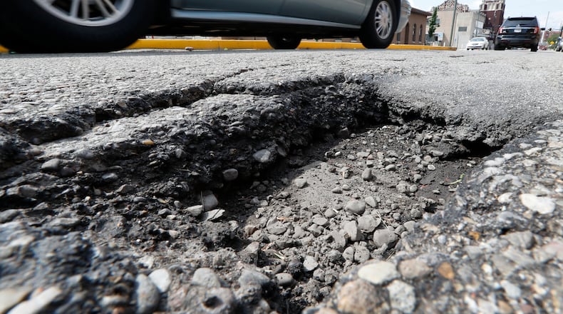 The Butler County Engineer’s Office plans to spend about $500,000 more to resurface roads in 2018. STAFF FILE PHOTO