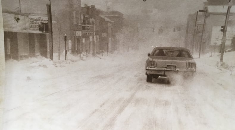 A car travels through the snow in Middletown in January, 1978. JOURNAL-NEWS ARCHIVE PHOTOS