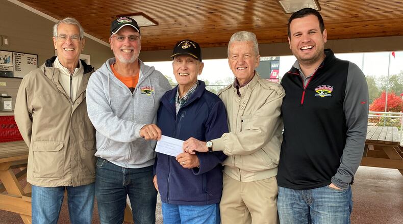 The Hamilton High class of 1954 donated on Oct. 29, 2021, the balance of its funds, $1,500, to the Nuxhall Foundation. Pictured, from left, are Nuxhall Foundation Vice Chairman Larry Tischler, Nuxhall Foundation Volunteer CEO Kim Nuxhall, Class of 1954 member Russ Moore, Class of 1954 member Bernie Jones, and Nuxhall Foundation Executive Director Tyler Bradshaw. MICHAEL D. PITMAN/STAFF