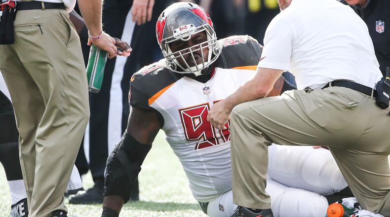 ORCHARD PARK, NY - OCTOBER 22: Chris Baker #90 of the Tampa Bay Buccaneers sits on the field after being injured during the second quarter of an NFL game against the Buffalo Bills on October 22, 2017 at New Era Field in Orchard Park, New York. (Photo by Tom Szczerbowski/Getty Images)
