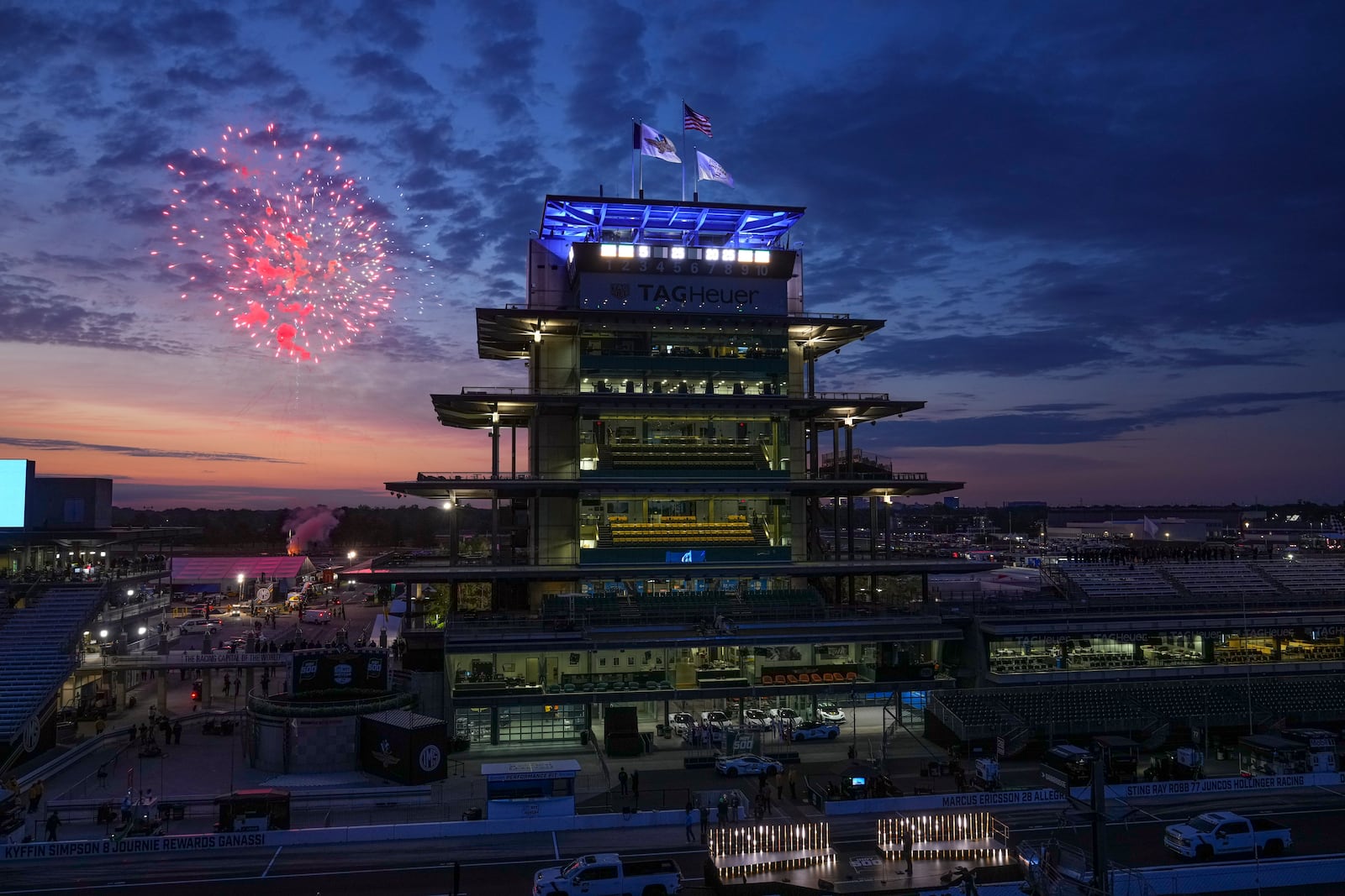 Fireworks are set off behind the Pagoda as the public gates open ahead of the Indianapolis 500 IndyCar auto race at the Indianapolis Motor Speedway in Indianapolis, Sunday, May 25, 2025. (AP Photo/Michael Conroy)