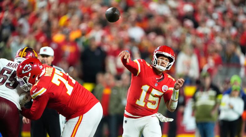 Kansas City Chiefs quarterback Patrick Mahomes (15) throws during the first half of an NFL football game against the Washington Commanders Monday, Oct. 27, 2025, in Kansas City, Mo. (AP Photo/Charlie Riedel)