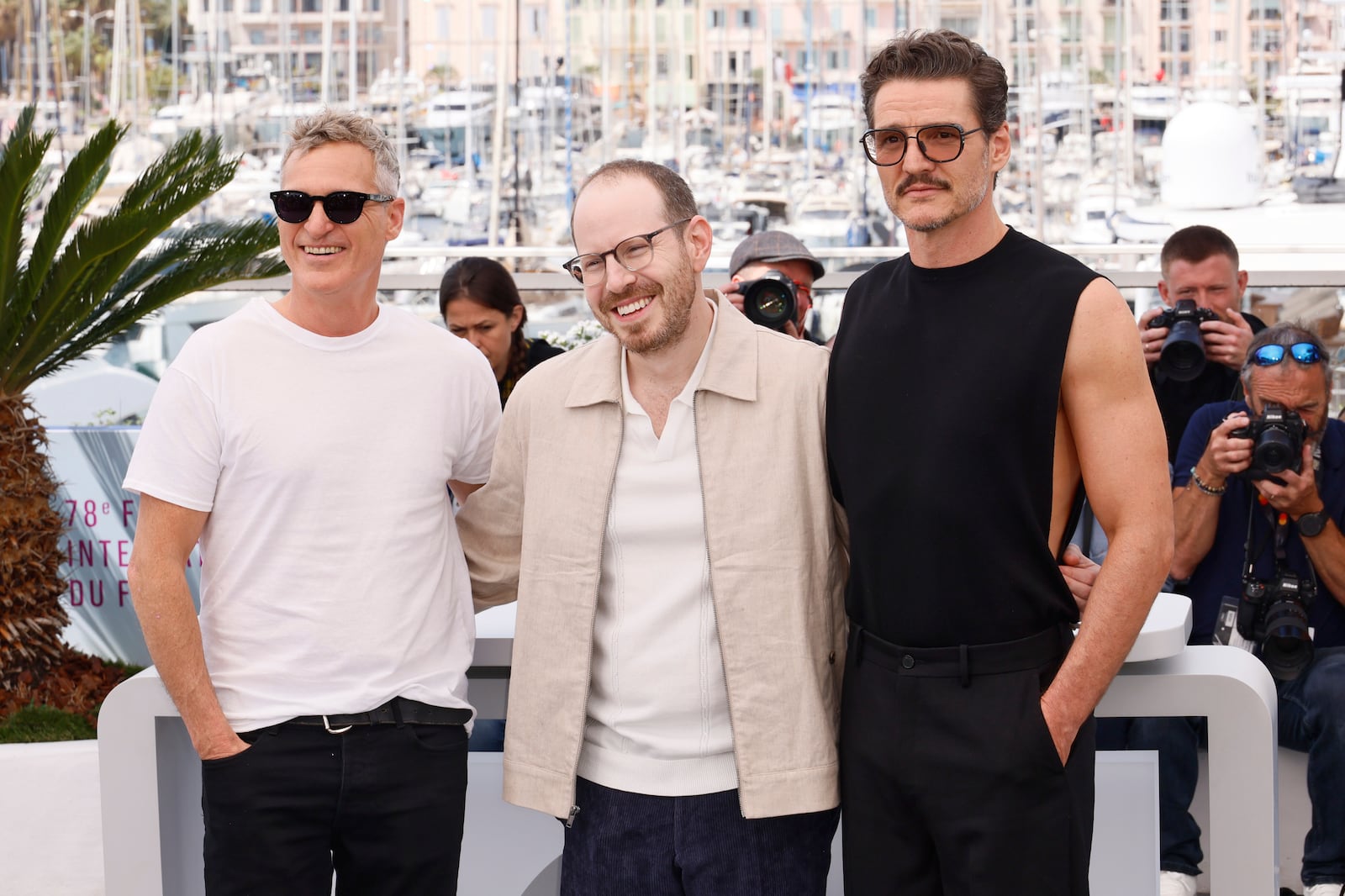 Joaquin Phoenix, from left, director Ari Aster and Pedro Pascal pose for photographers at the photo call for the film 'Eddington' at the 78th international film festival, Cannes, southern France, Saturday, May 17, 2025. (Photo by Joel C Ryan/Invision/AP)
